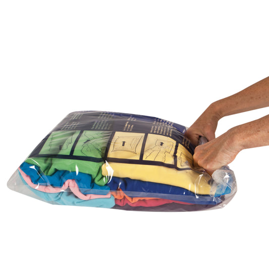 Product Image – Hands compressing clothes in a Travelon Set of 2 Compression Packing Bags.