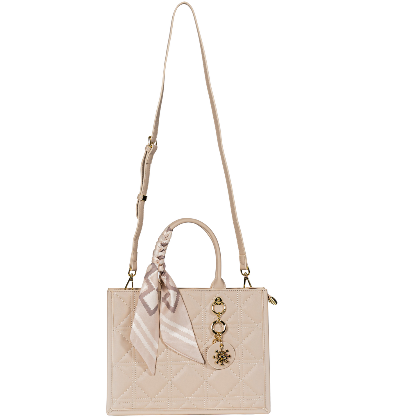 Beige quilted Sayan Top Zip Handbag Tote with long strap, gold charms, and tied pink patterned scarf.