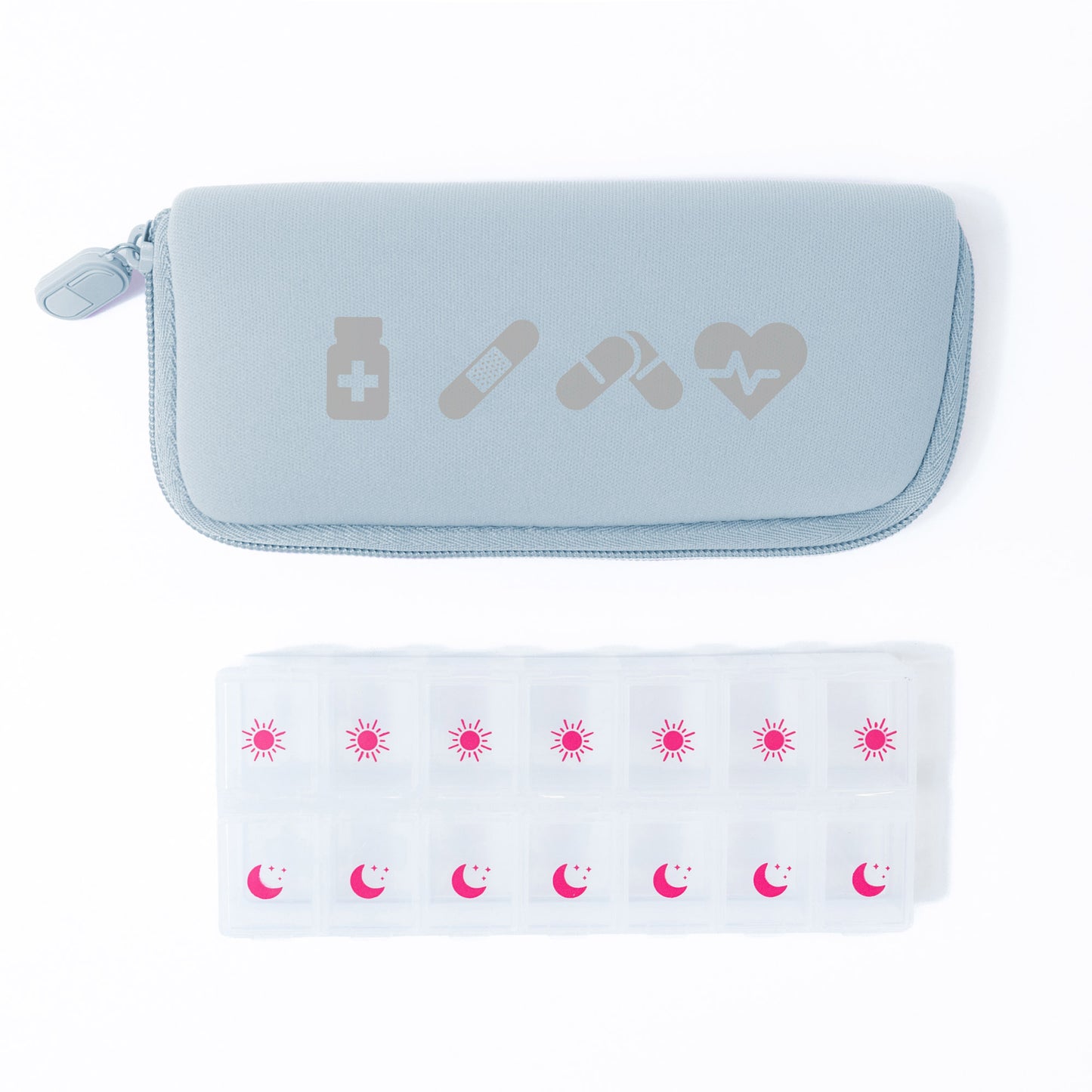 A light blue zippered pouch holds the MyTagAlongs Icons Vitamin Organizer, labeled with sun and moon for each day.