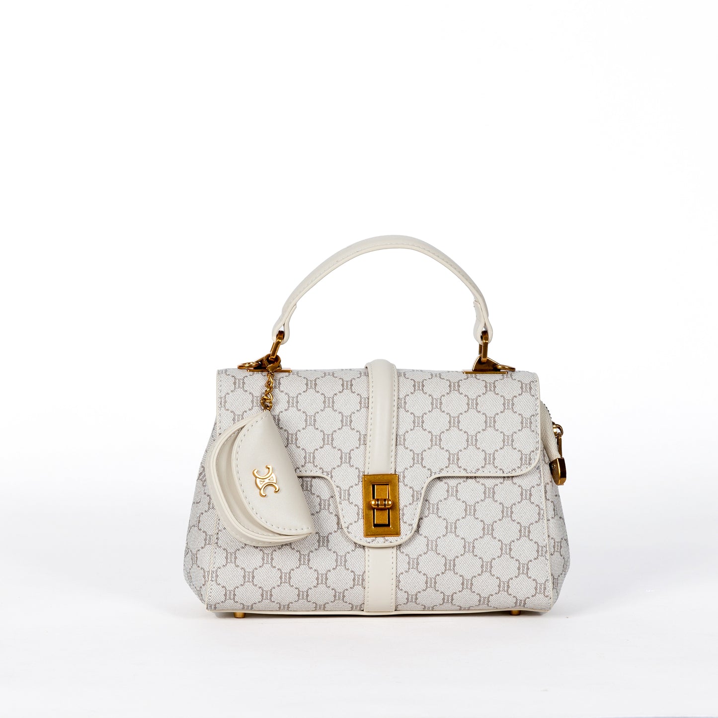 Miss Caprice Brianne satchel in cream pattern, gold clasp, and pouch against a plain background.