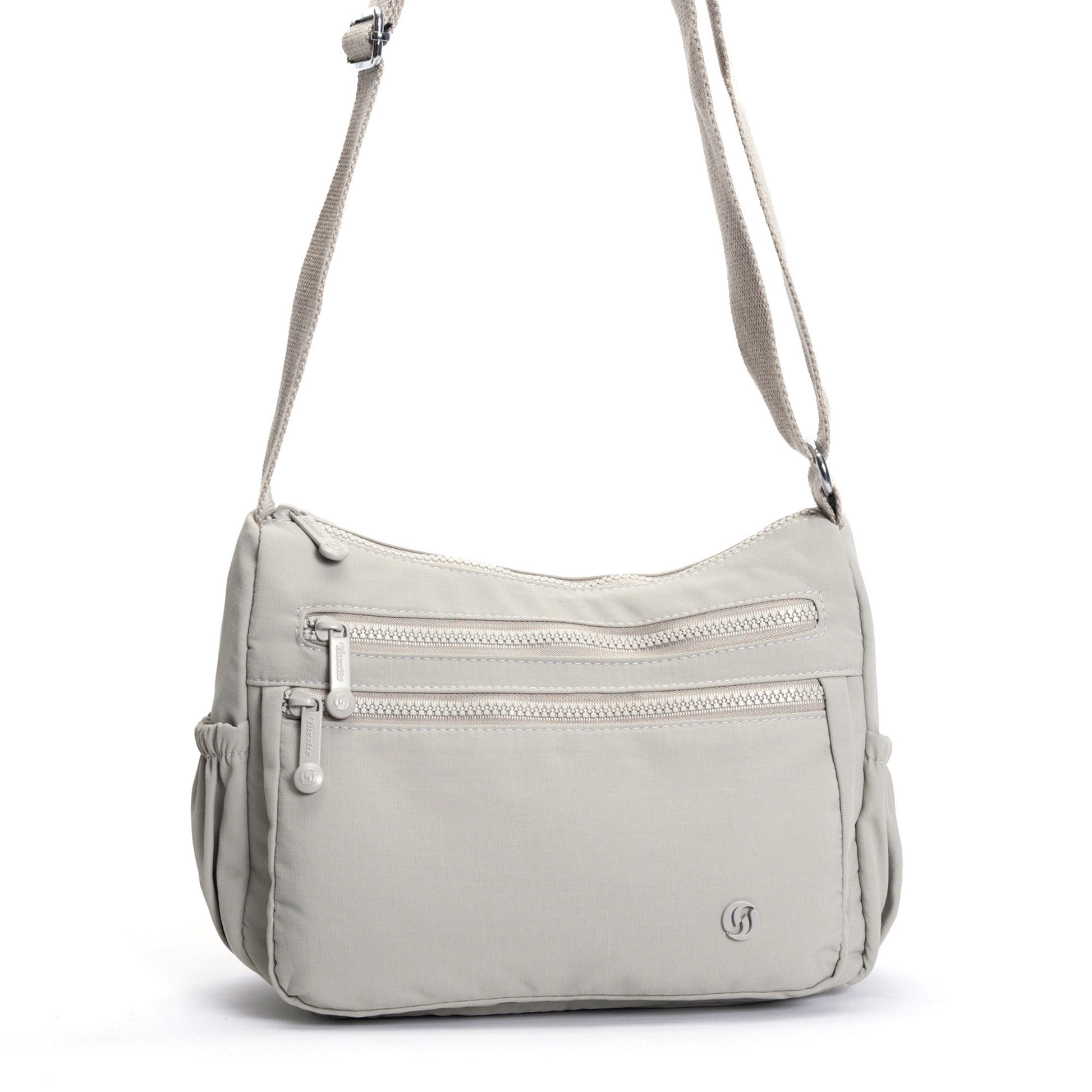 Miss Caprice Multi-zip Crossbody: cream bag with front zips & adjustable strap, ideal for travel.