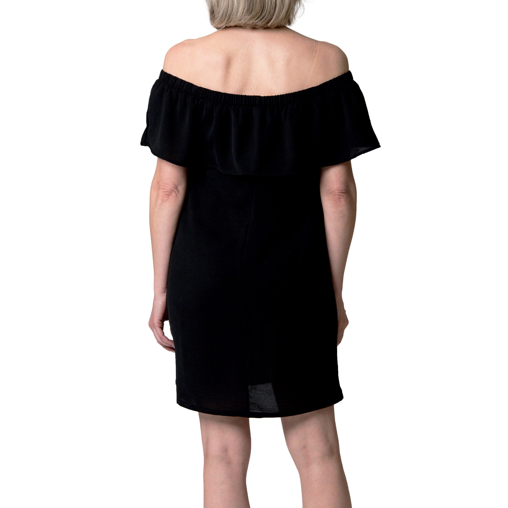 Woman facing away in the Cover Me Short Frill Airflo Cover Up, a black off-shoulder summer dress with ruffles.