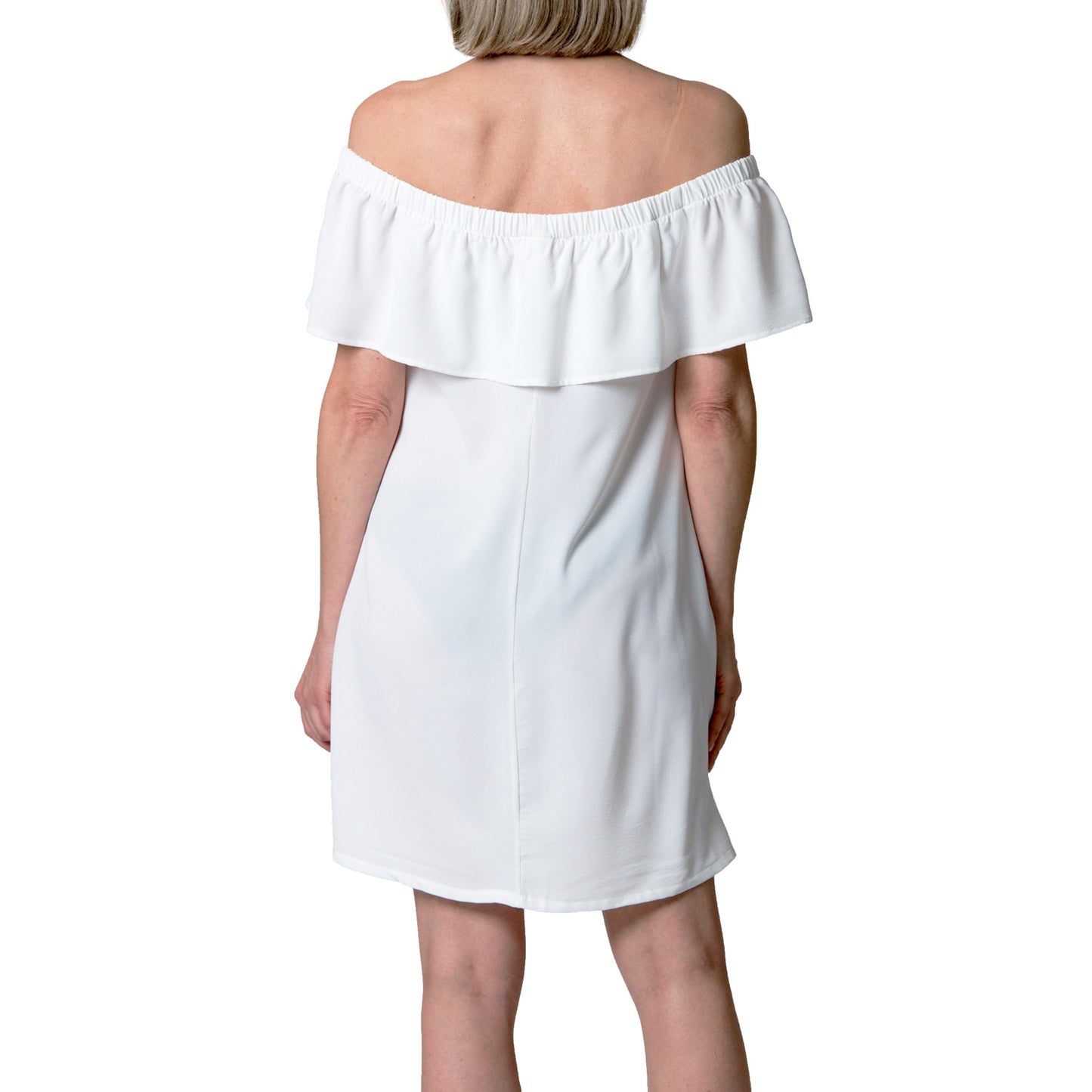 A woman wears the Cover Me Short Frill Airflo Cover Up, shown from the back on a white background.