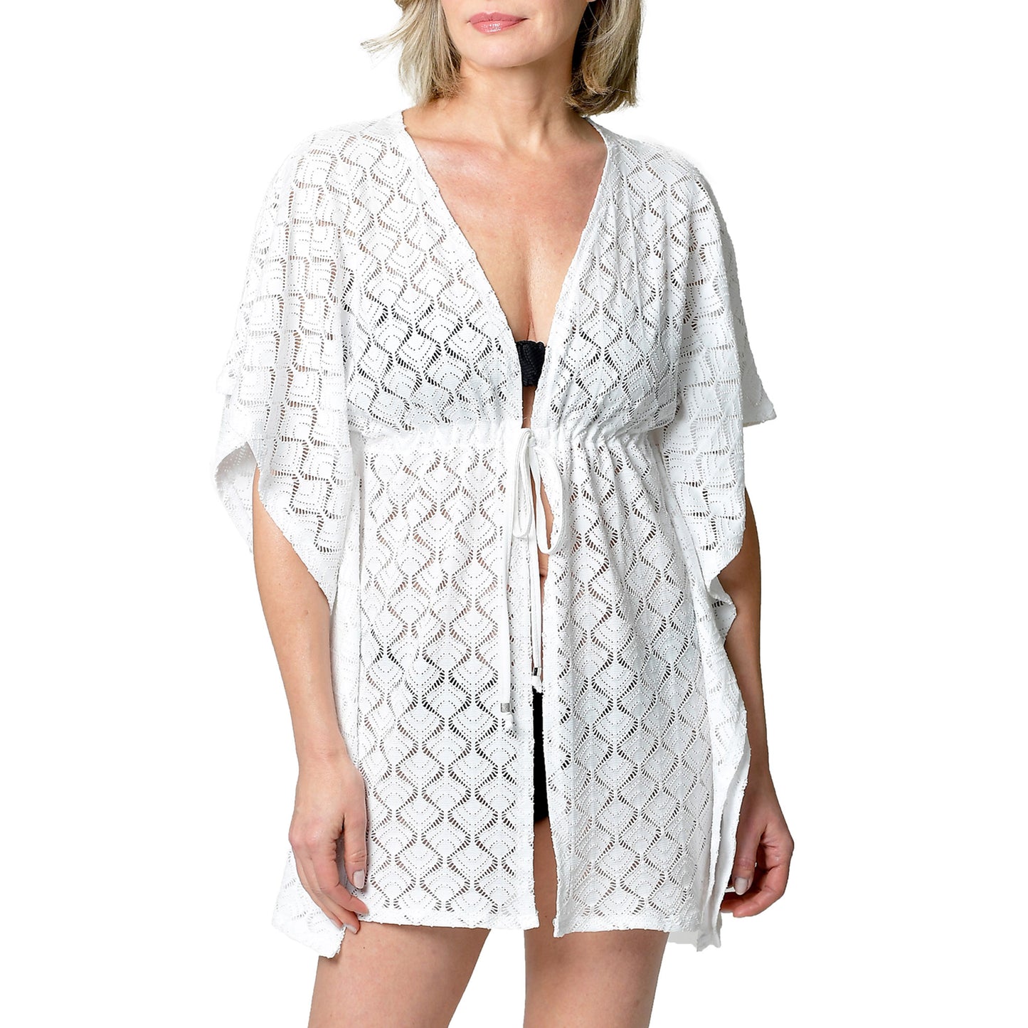 Model in Cover Me Kaftan/Duster Cover Up over black swimsuit against plain background.