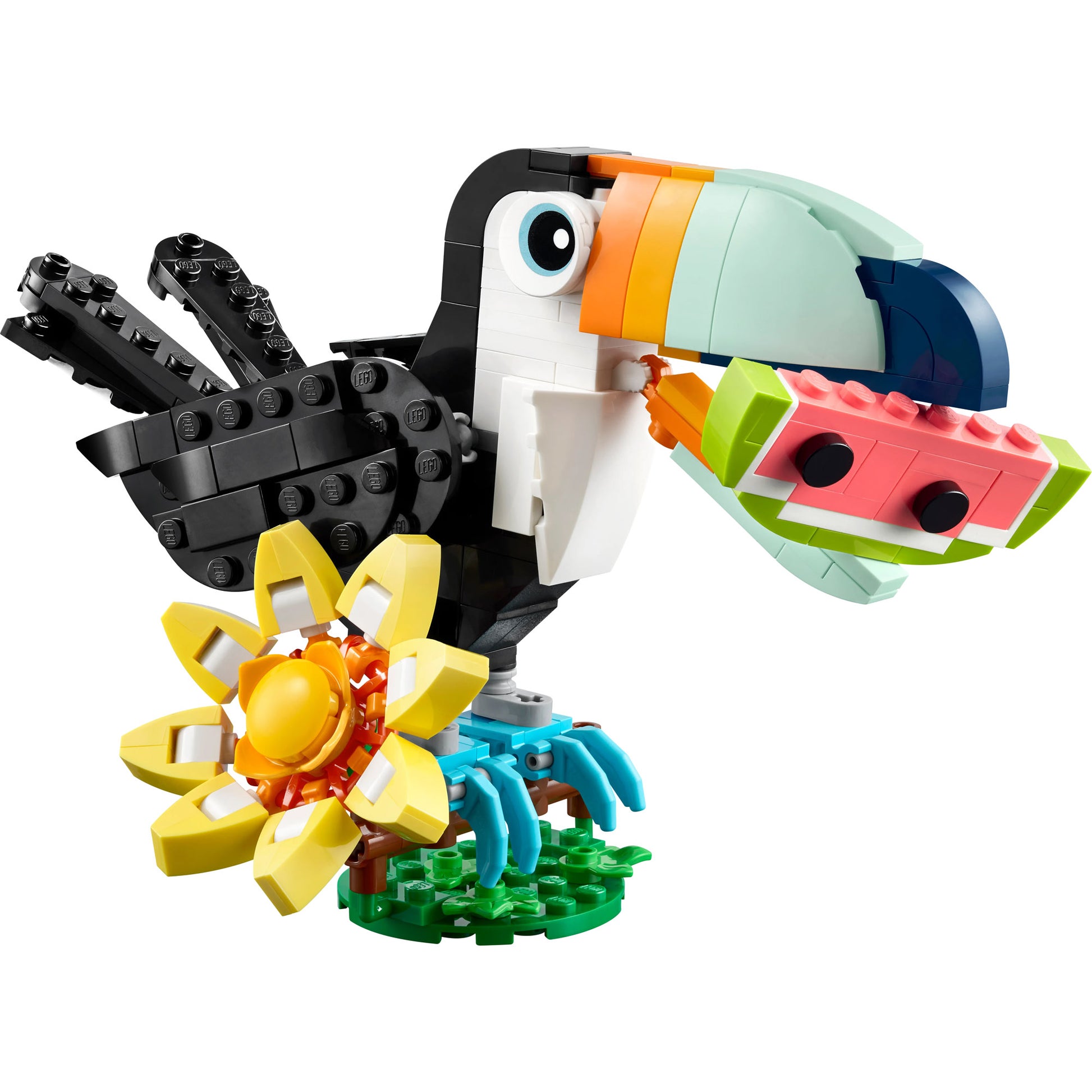 Build a posable LEGO® Wild Animals: Tropical Toucan with flower and watermelon on a green base.