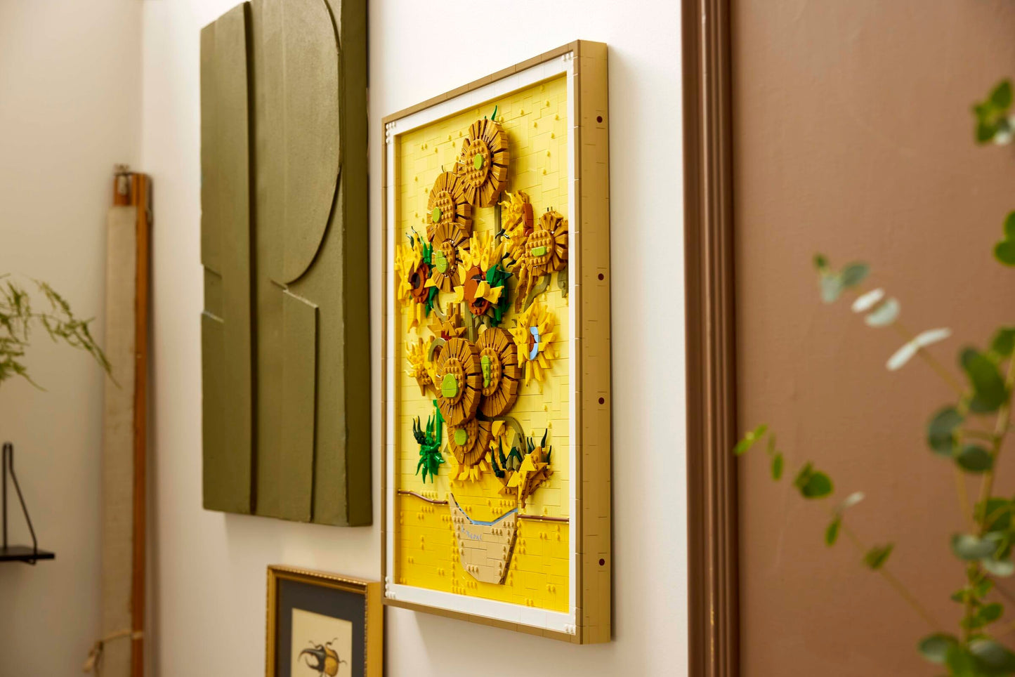 The LEGO® Vincent van Gogh - Sunflowers set by LEGO adds a bright touch to your wall decor.
