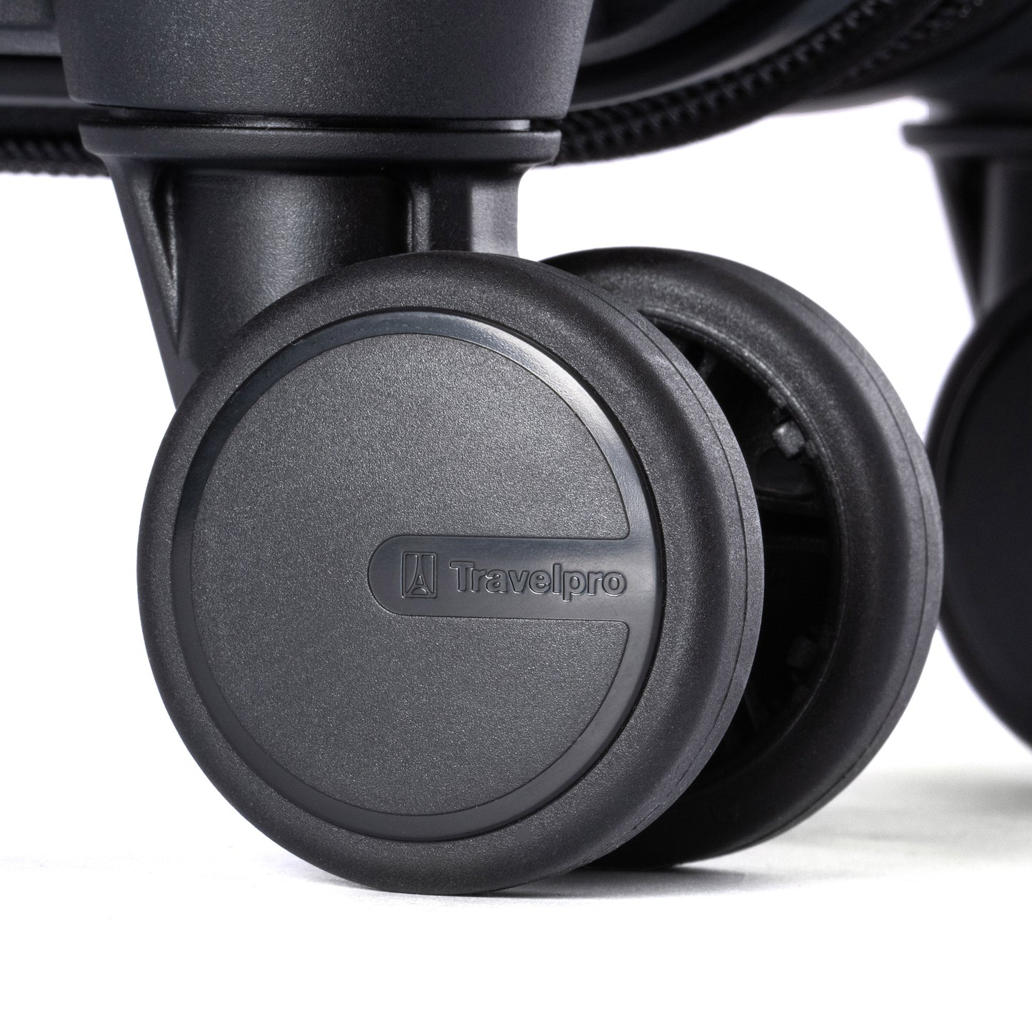 Close-up of a Travelpro® Maxlite® Air V2 spinner suitcase wheel showing the Travelpro logo at the center.