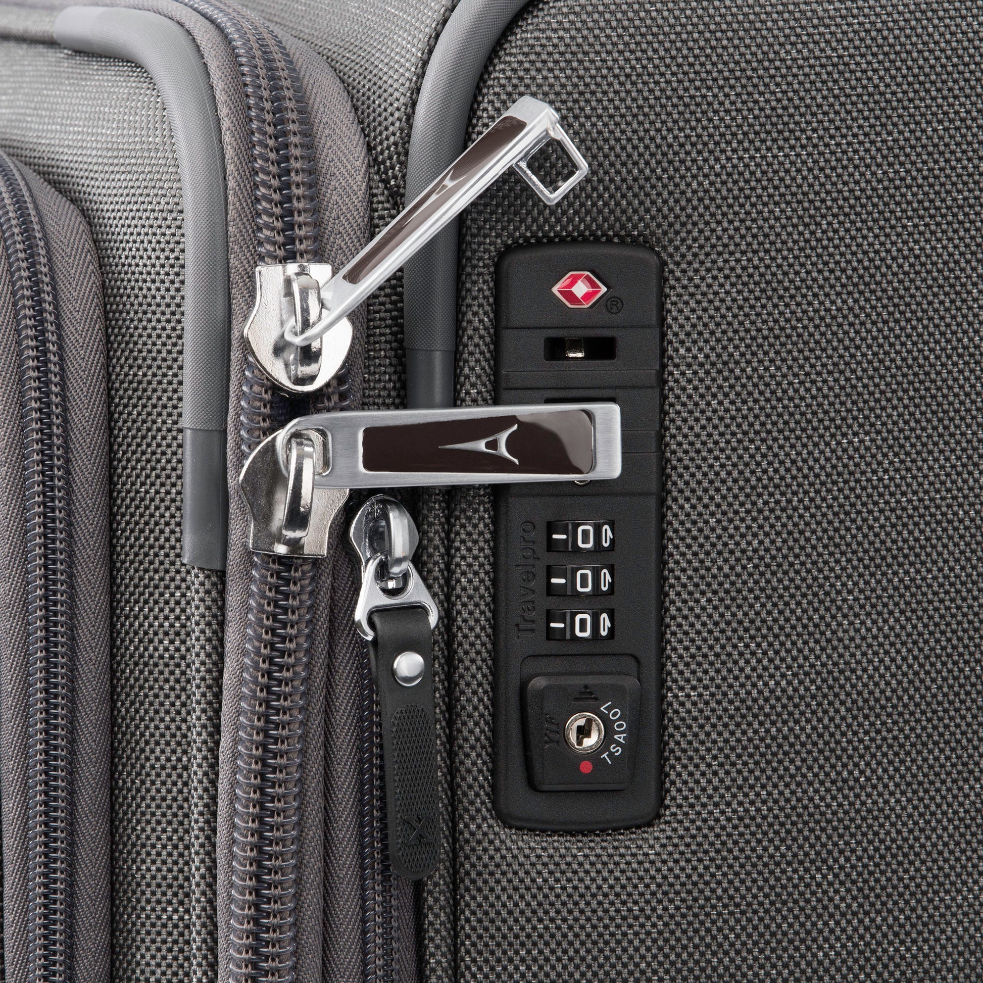 Close up of lockable zipper pulls and TSA lock on side of vintage grey Travelpro® Platinum® Elite 25" Expandable Spinner