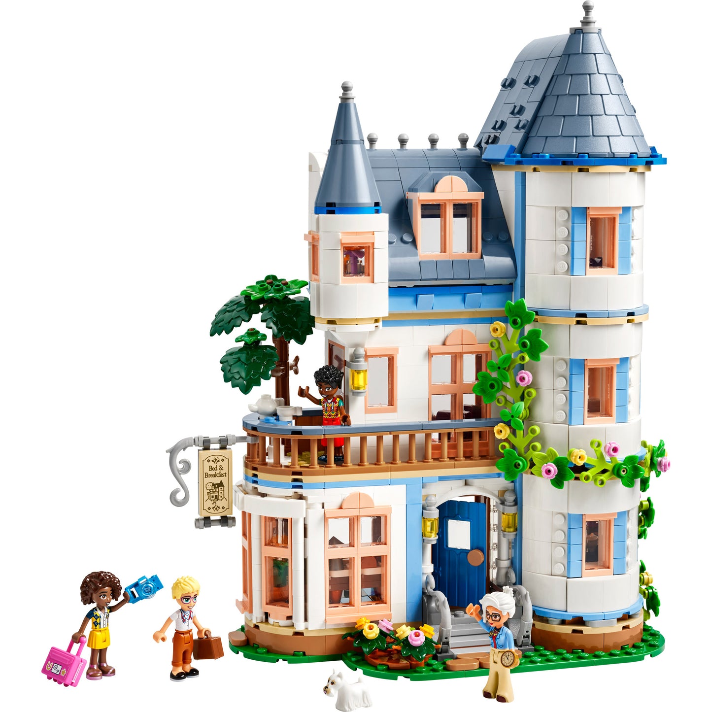 LEGO® Castle Bed and Breakfast: three-story set with figures, leafy walls, and a small white dog in front.
