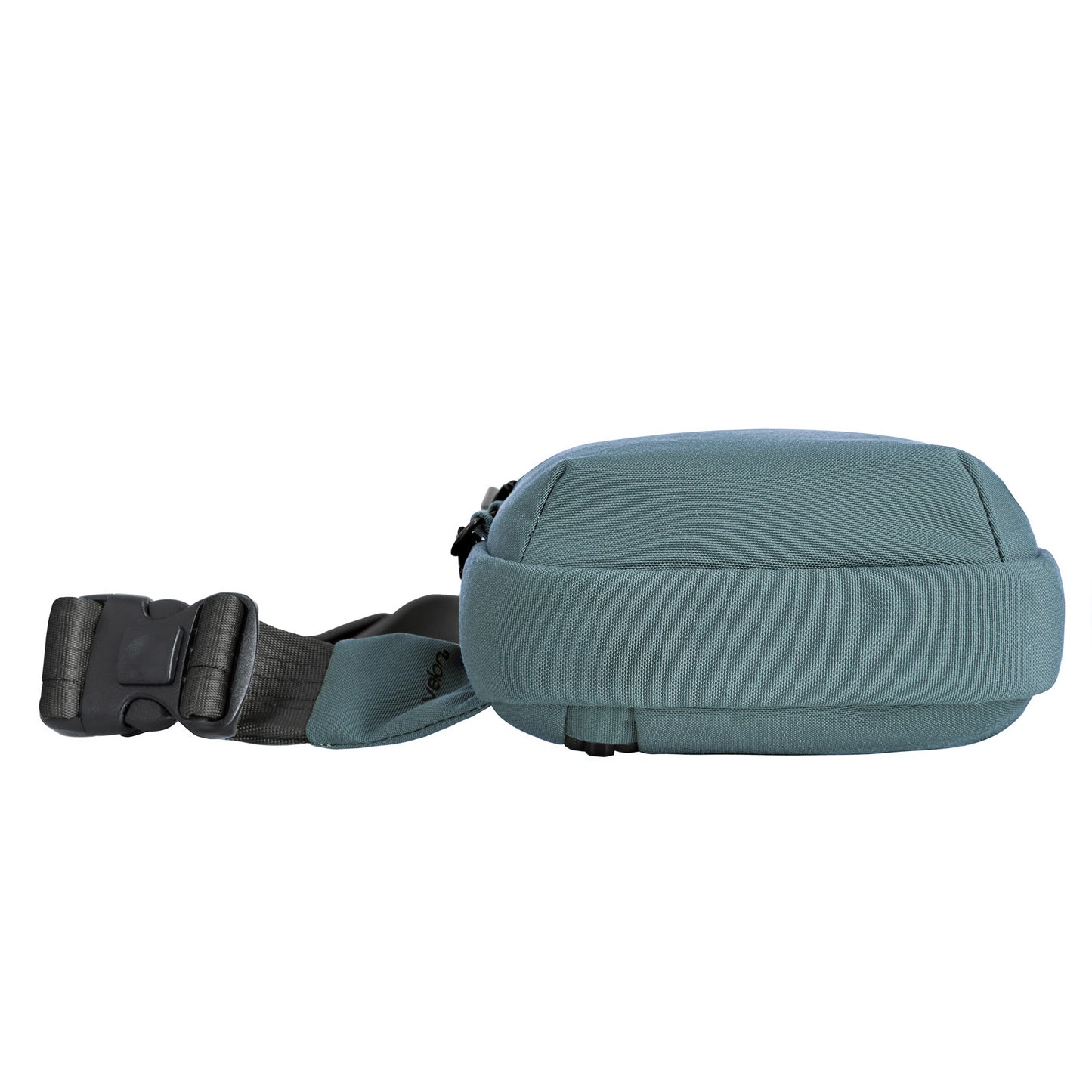 Bottom view of Travelon Voyages Anti-Theft Compact Sling, slate blue with a black adjustable strap and buckle for hands-free use.