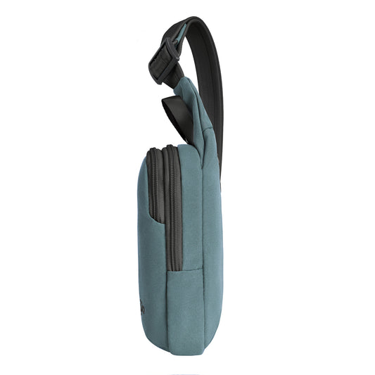 Product Image – Side view of Travelon Voyages Anti-Theft Compact Sling in slate blue with a black strap and two zippered compartments.