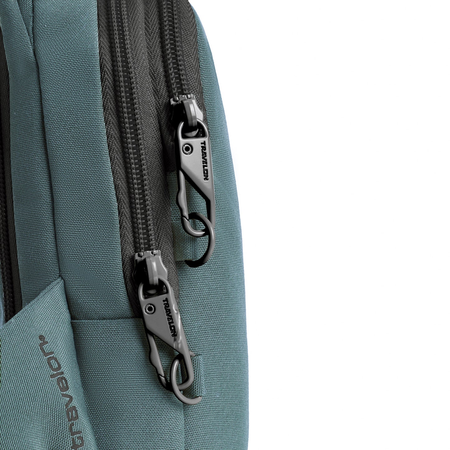 Close-up of a slate blue Travelon Voyages Anti-Theft Compact Sling with two locking zippers.