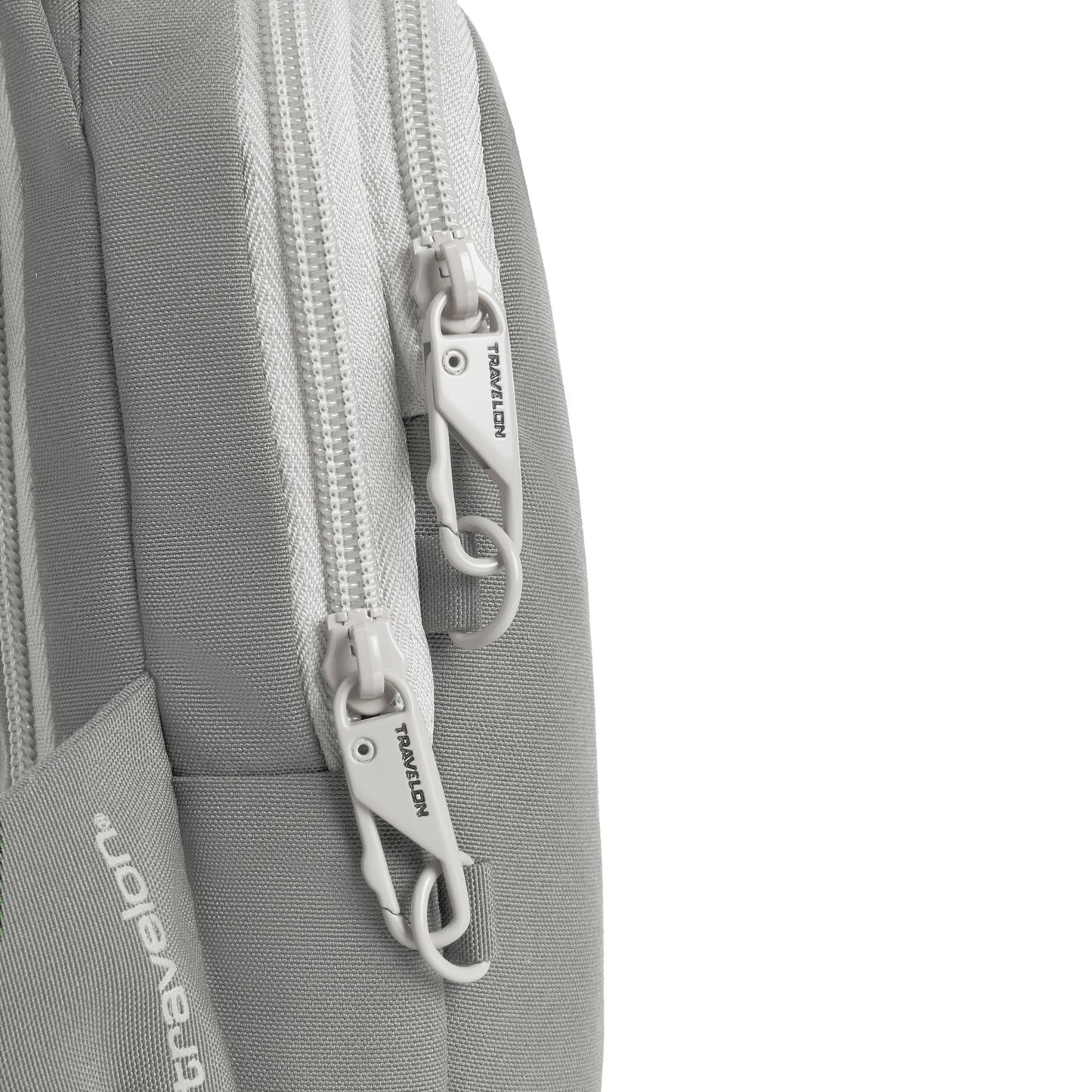 Close-up of a Travelon Voyages Anti-Theft Compact Sling in granite, featuring two main lockable zippers.