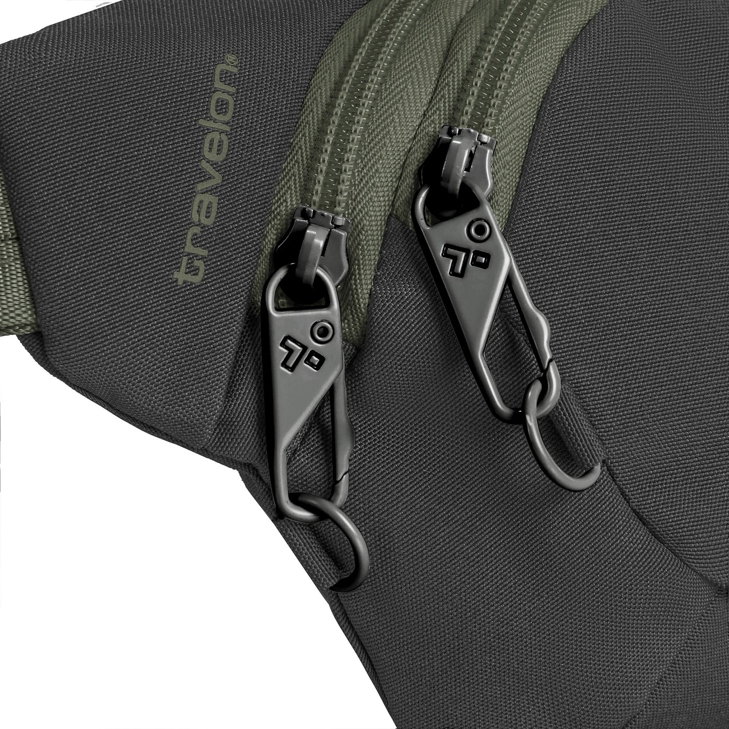 Close-up of dual lockable zippers on a Travelon Voyages Anti-Theft Waist Pack in black with green zippers.