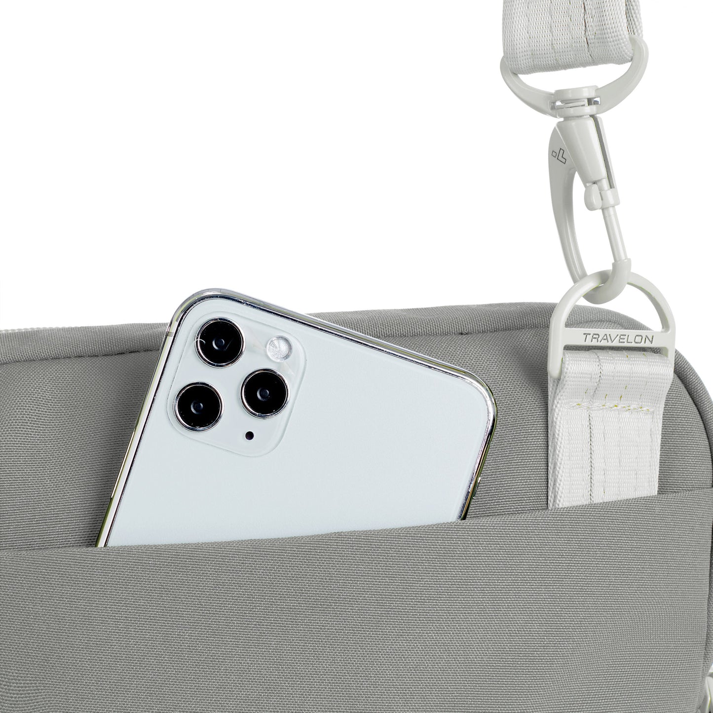 Back view of granite Travelon Voyages Anti-Theft Slim Bag with phone peeking out of the back slip pocket.
