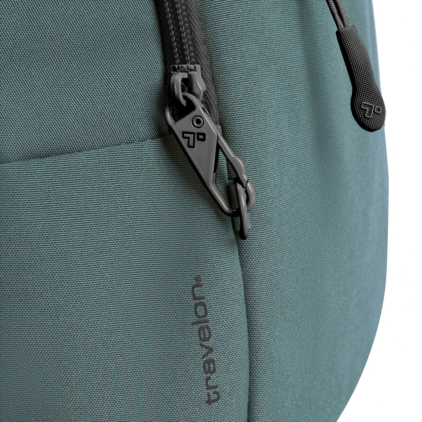 Close-up of a slate blue Travelon Voyages Anti-Theft Tour Bag with locking zippers, featuring RFID blocking for extra security.