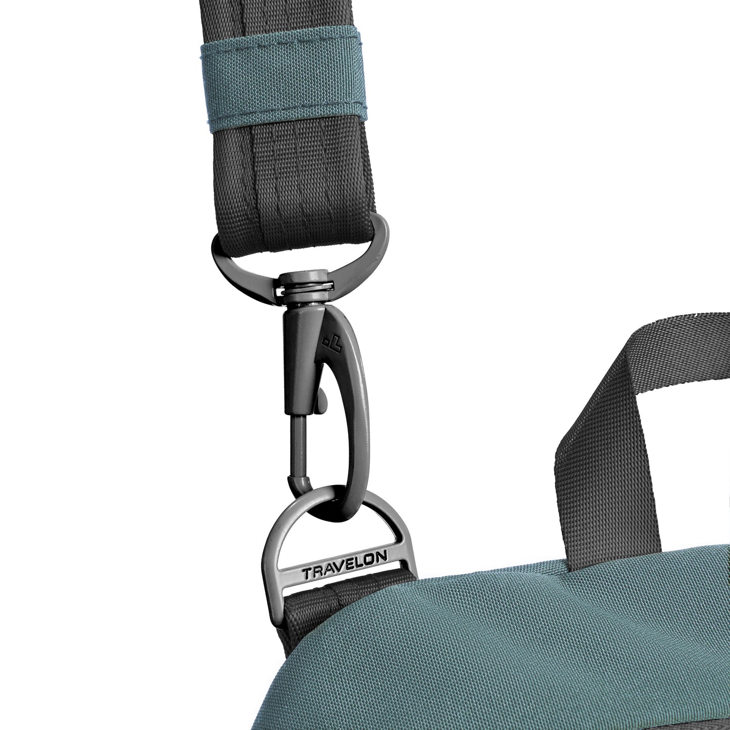 Close-up of a gray carabiner on a strap from the Travelon Voyages Anti-Theft Tour Bag for crossbody ease.