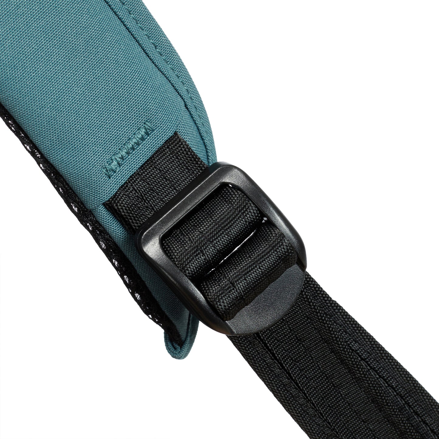 Close-up of a black buckle securing straps on the slate blue Travelon Voyages Anti-Theft Small Backpack.