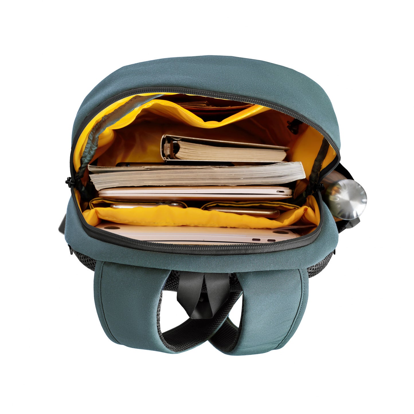 Travelon Voyages Anti-Theft Day Pack with RFID blocking pockets holds books, a laptop, and a side-pocket water bottle.