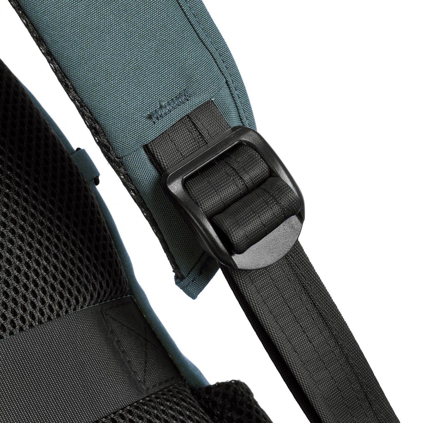 Close-up of the black strap buckle on the Travelon Voyages Anti-Theft Day Pack with mesh fabric and slash-resistant design.