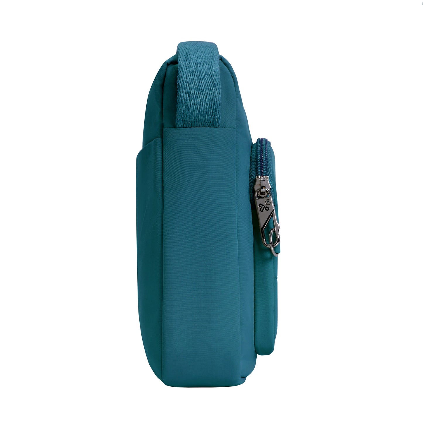 Side view of the Travelon Roam capri blue crossbody, featuring its strap, zipper, and two compartments.