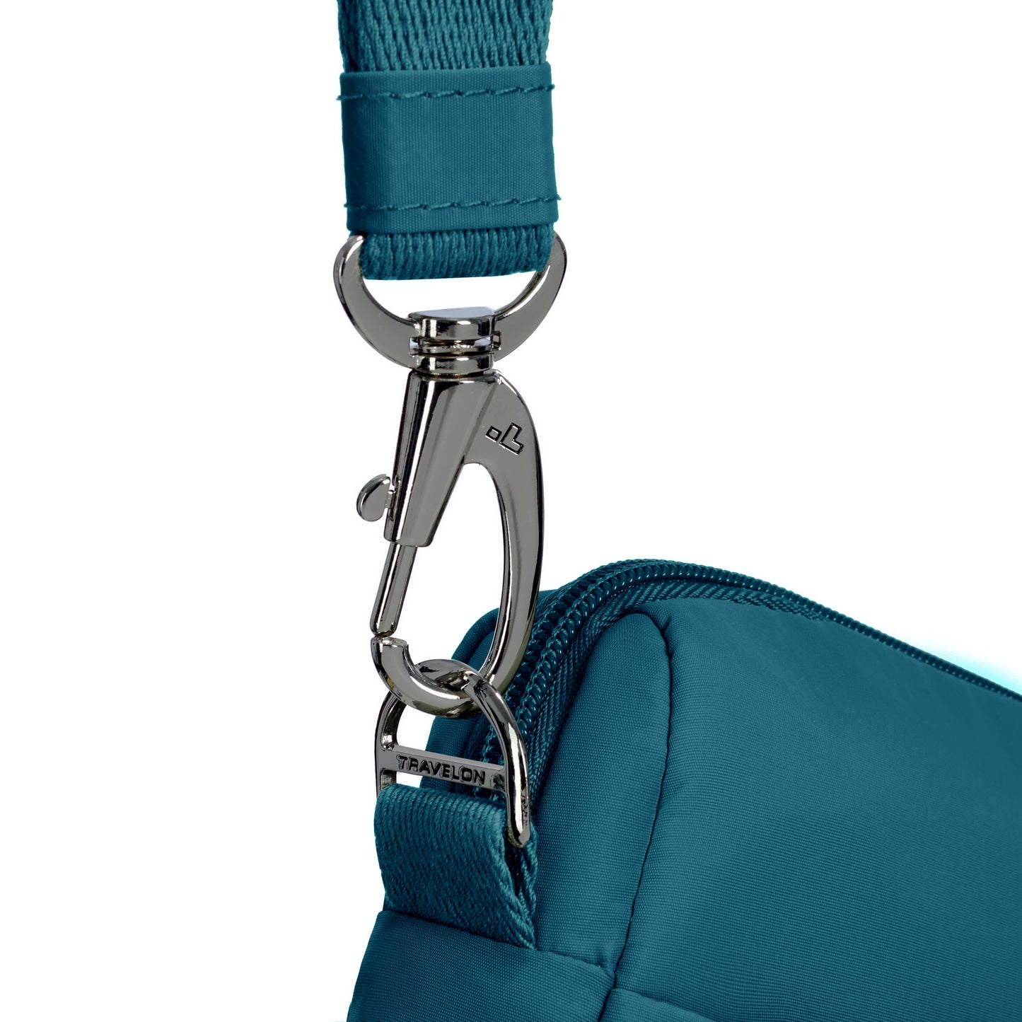 Travelon Roam bag close-up: metal clip secures strap on lightweight capri blue nylon crossbody.