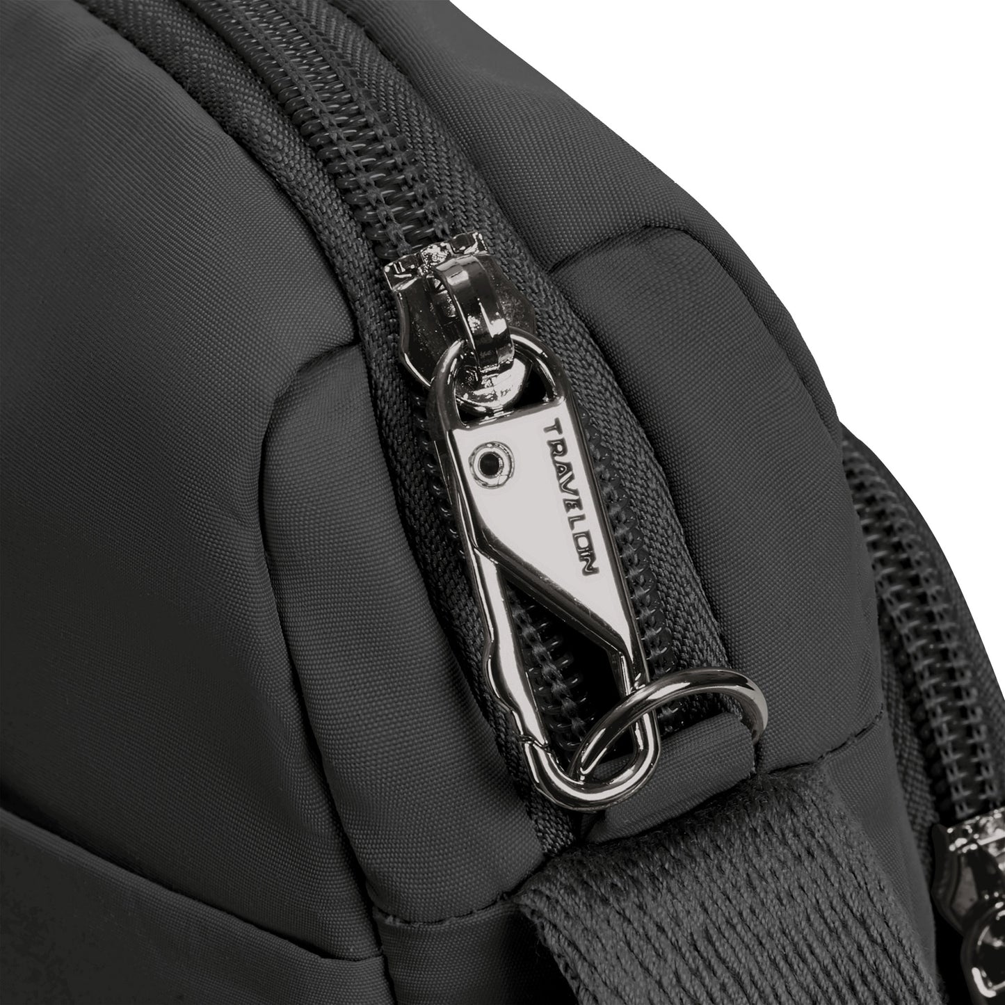 Close-up of the Travelon Roam Anti-theft East/West Crossbody, a black bag with metal zipper and carabiner-style clip.