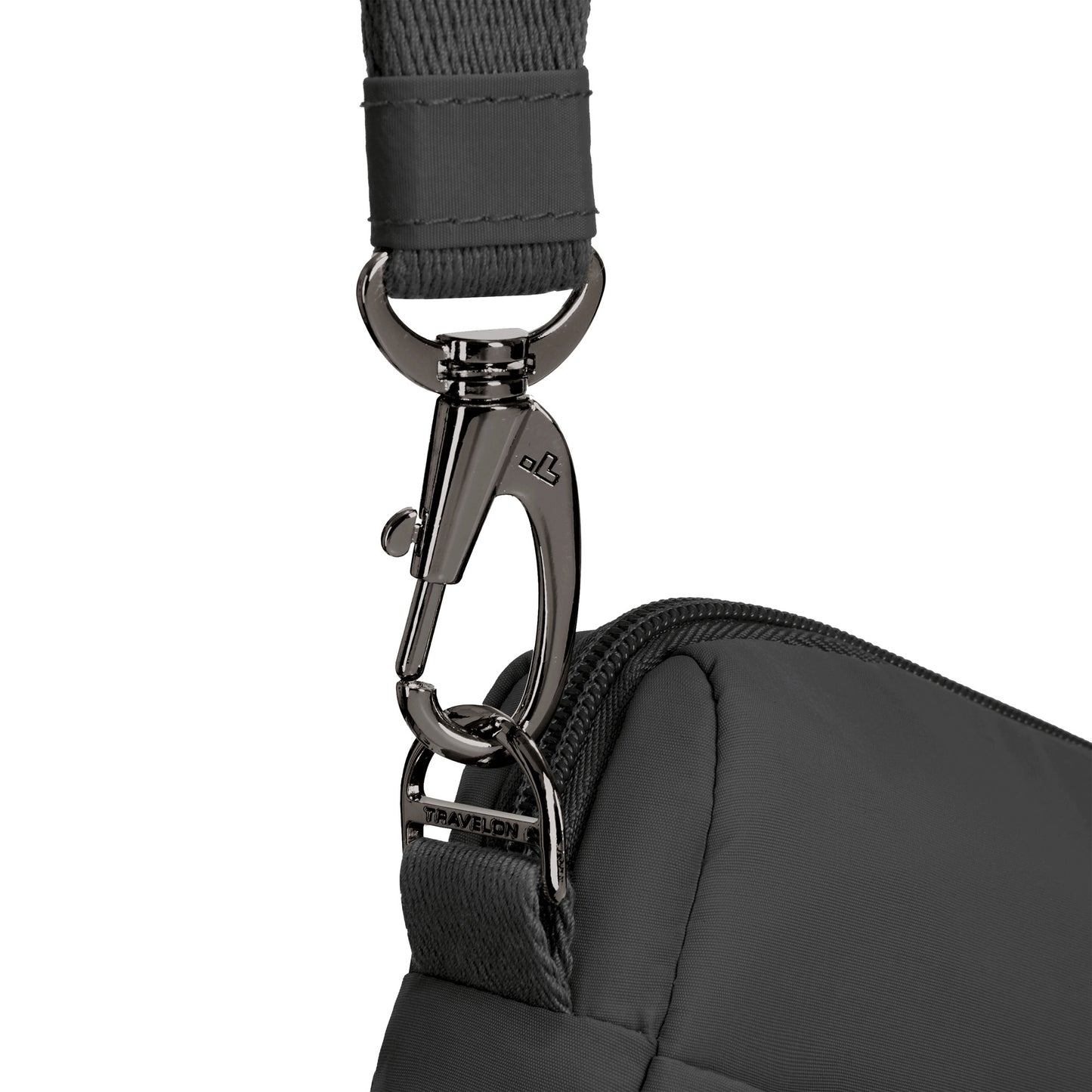 Close-up of the Travelon Roam Crossbody's strap clip and zipper, highlighting its lightweight nylon build.