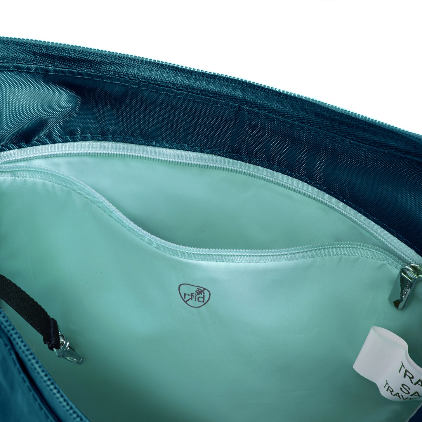 Capri blue Travelon Roam anti-theft nylon bag with inner zippered RFID pocket unzipped.