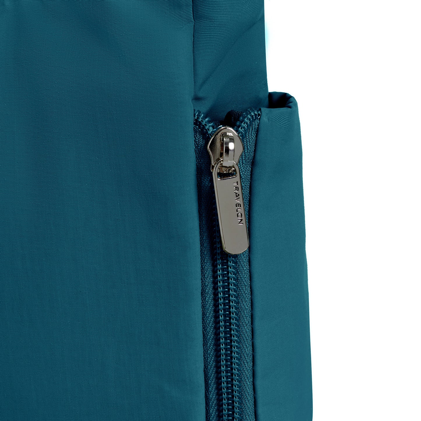 Close-up of a Travelon Roam anti-theft crossbody, capri blue nylon with a silver zipper.