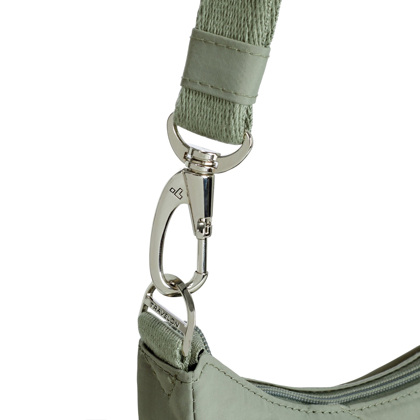 Close-up of Travelon's Roam Anti-theft Crossbody strap with a silver clasp and anti-theft ring.