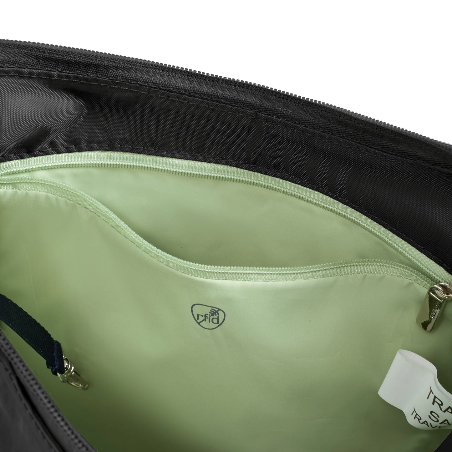 Close up of green lining of black Travelon Roam Anti-theft Medium Crossbody with zippered RFID pocket unzipped.