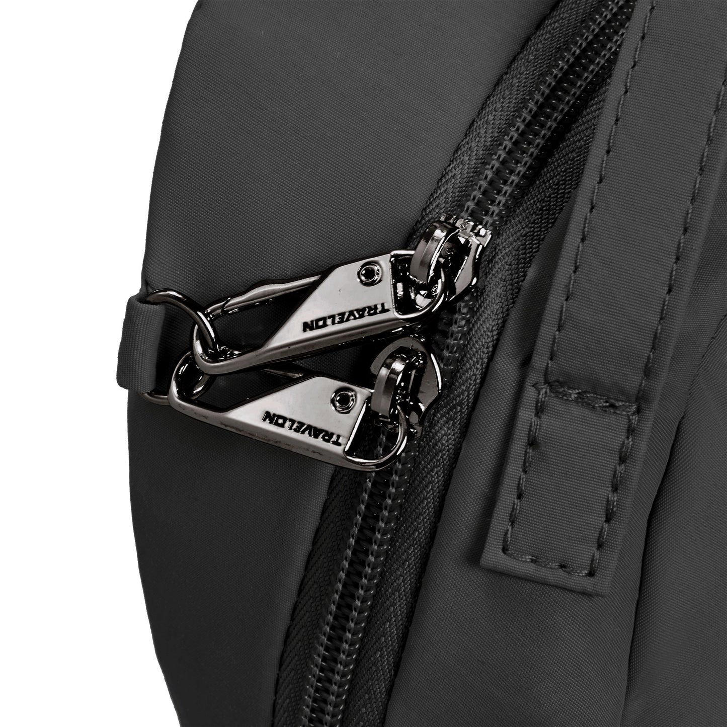 Close-up of the Travelon Roam convertible bag with silver zippers, highlighting its anti-theft security features.