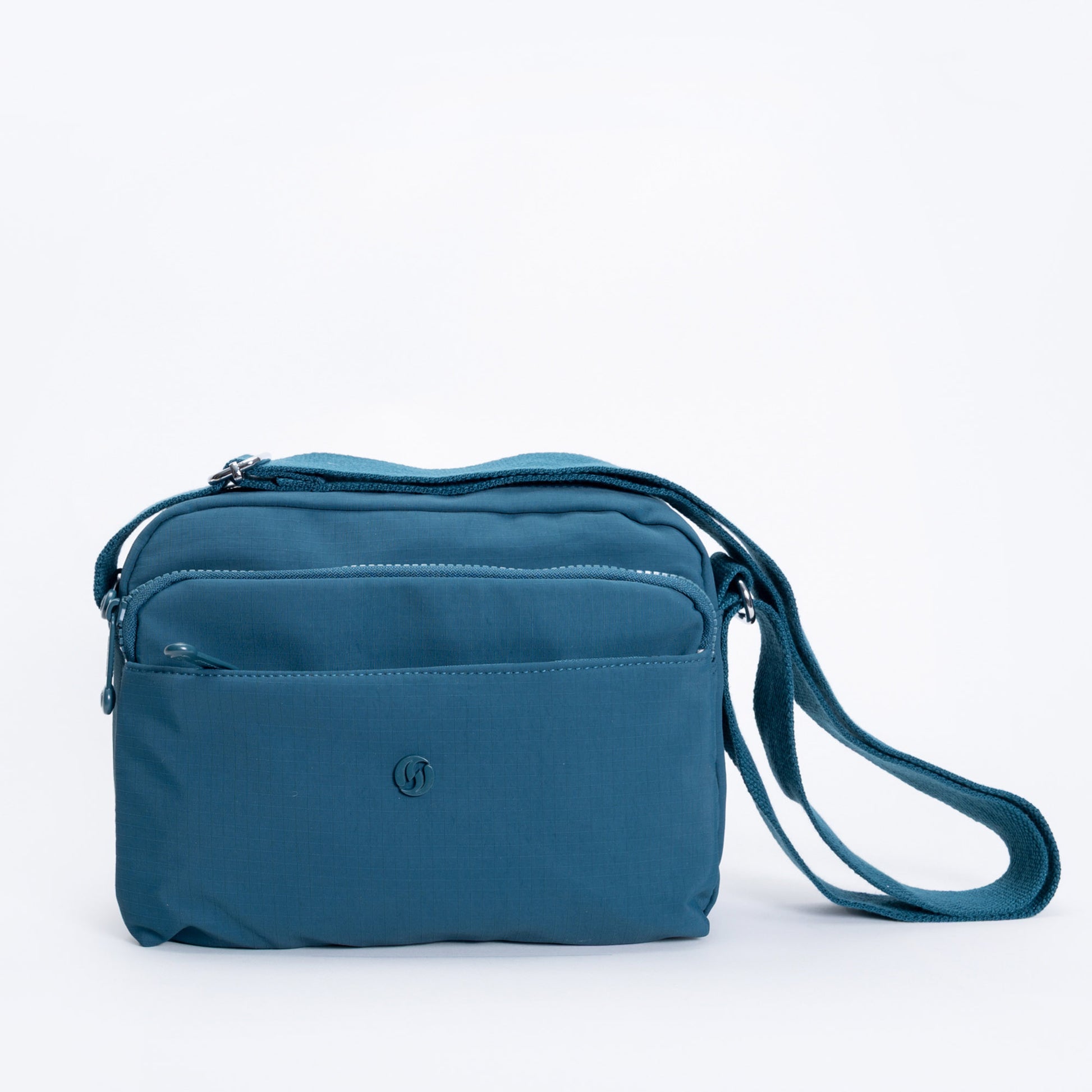 Miss Caprice Multi-zip Square Crossbody in teal features two zip pockets—ideal for everyday use.