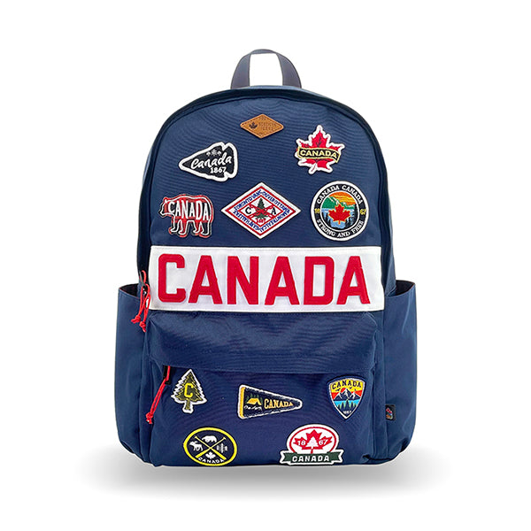 Northern Icons Canada Classic Backpack in navy with Canadian patches and "CANADA" on the front pocket.