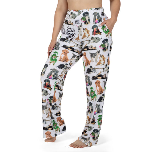 Product Image – Woman models Brief Insanity Lounge Pants—cute dog print, pockets, barefoot; ideal gift for dog lovers.