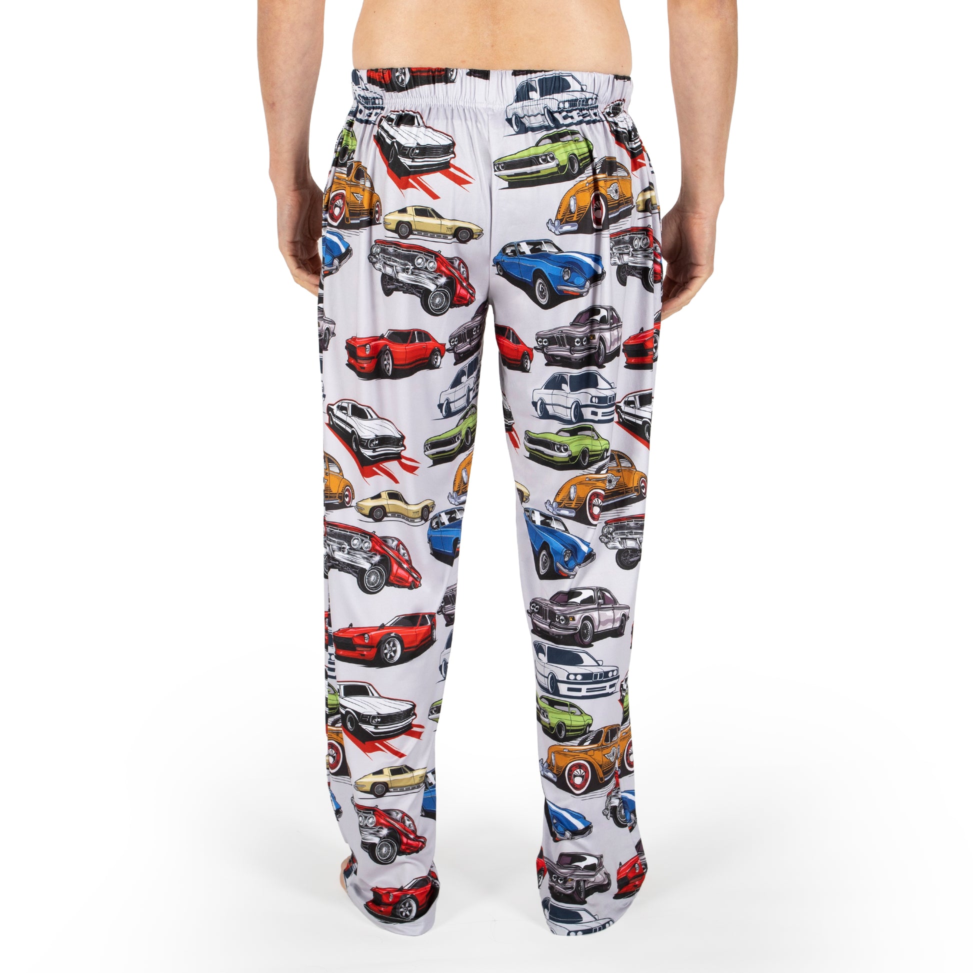 Person wearing Brief Insanity "I'm Not Old I'm a Classic" lounge pants, shown from the back against white.