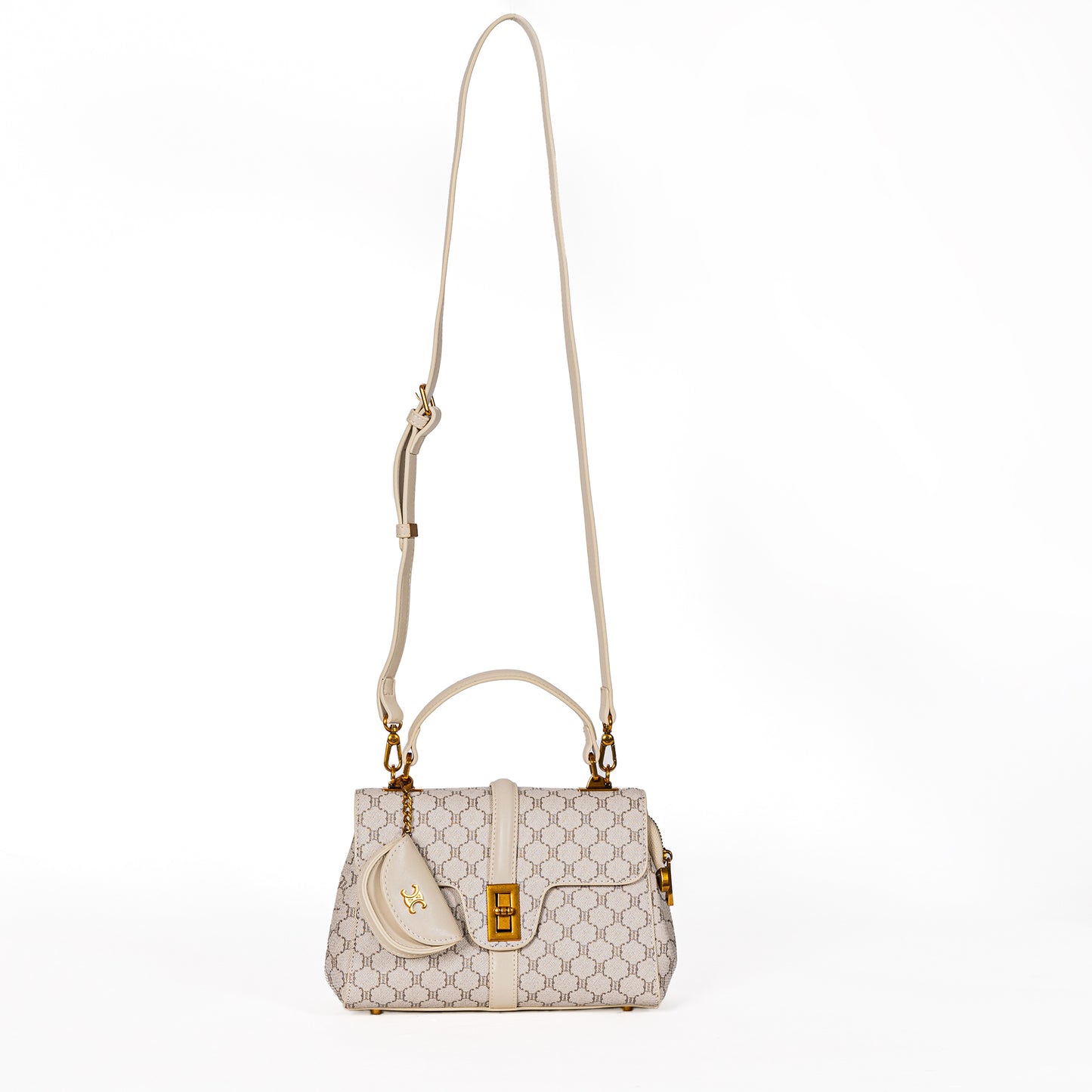 The Miss Caprice Brianne Handbag Tote is a cream satchel with pattern, front pocket, and adjustable strap.
