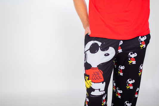 Product Image – Person wears Brief Insanity Lounge Pants featuring Peanuts Snoopy Joe Cool design, against a plain background.