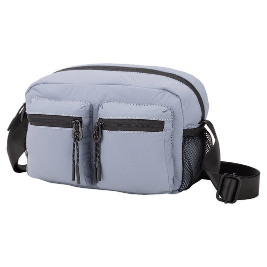 Product Image – Bench Nylon Crossbody: Light blue bag with two zip pockets, mesh side pocket, and adjustable black strap.