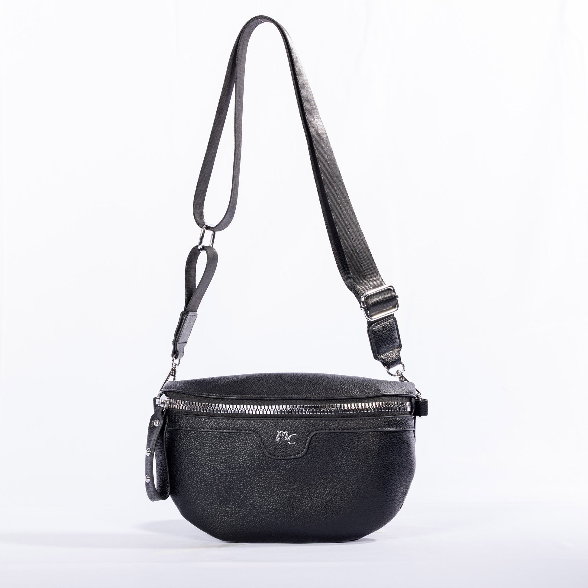 The Miss Caprice Waist/Crossbody Bag has a zip closure, silver hardware, and an adjustable nylon strap.