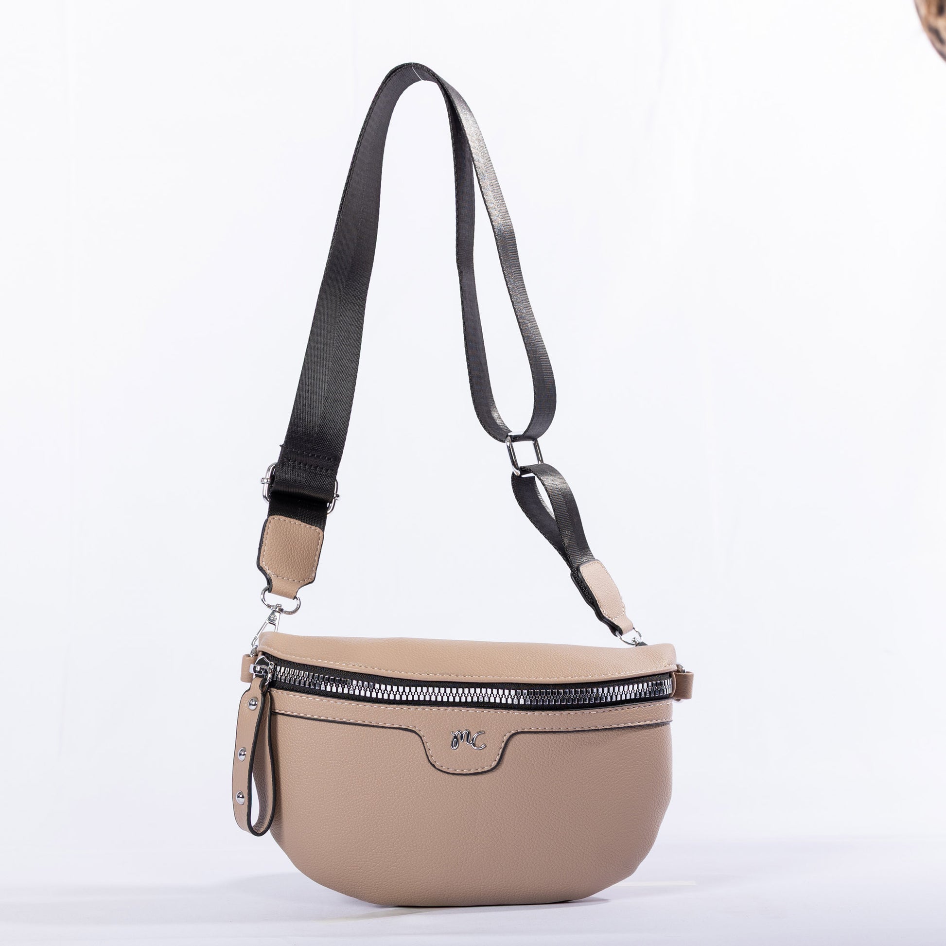 Miss Caprice Waist/Crossbody Bag in beige with adjustable nylon strap for convenient hands-free style.