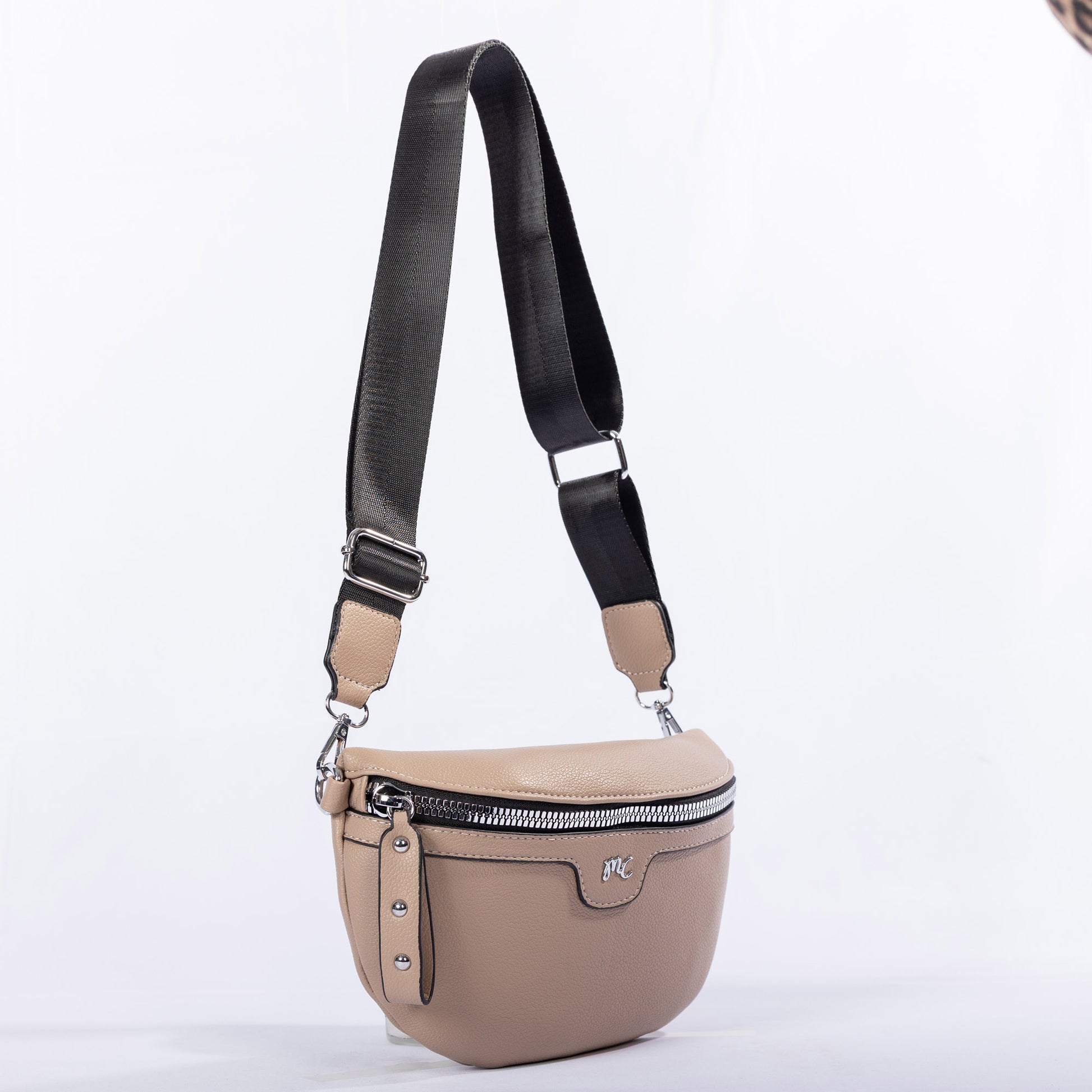 Miss Caprice Waist/Crossbody Bag in beige with silver zipper and adjustable nylon strap for hands-free use.