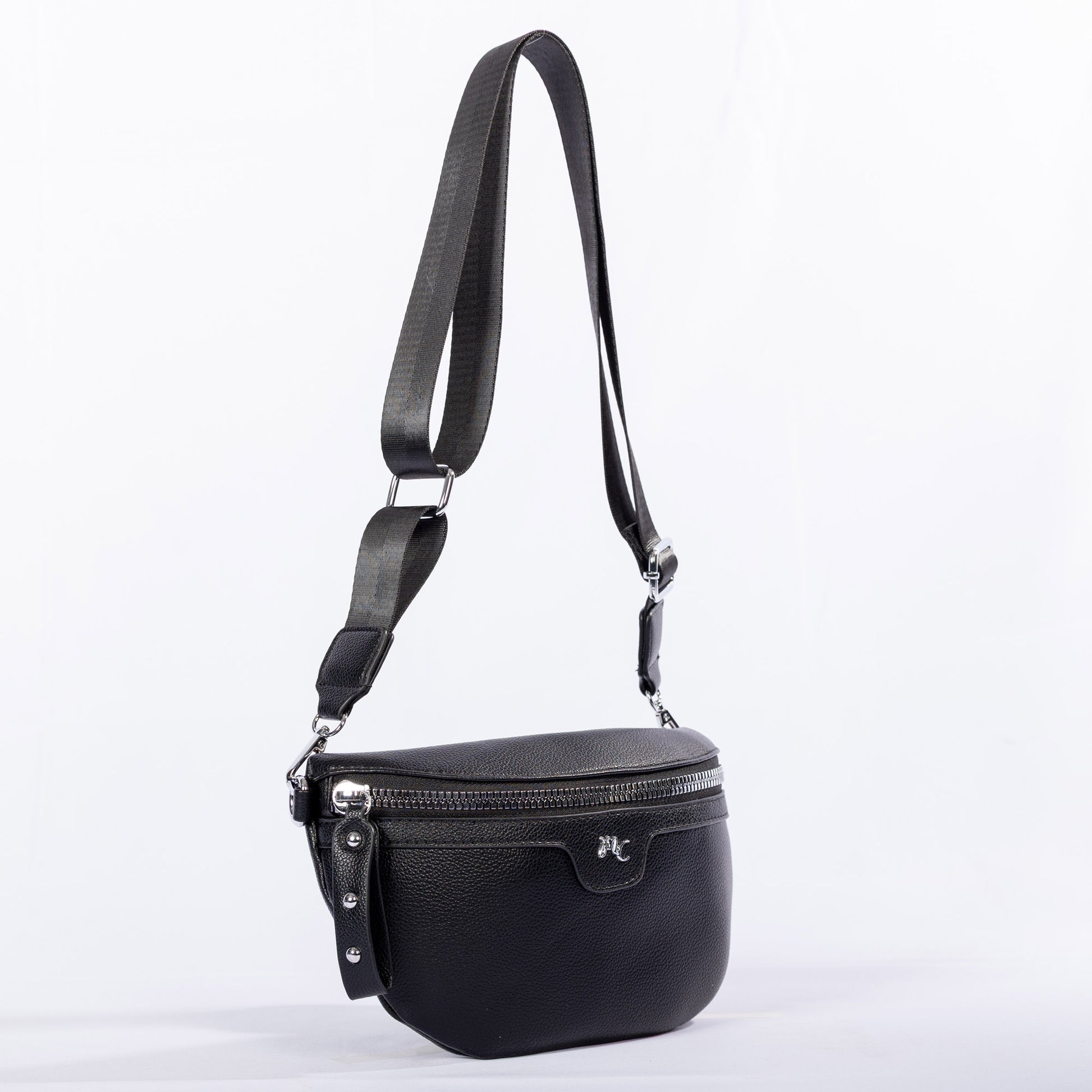 The Miss Caprice Waist/Crossbody Bag has a wide adjustable nylon strap and a front zipper pocket.