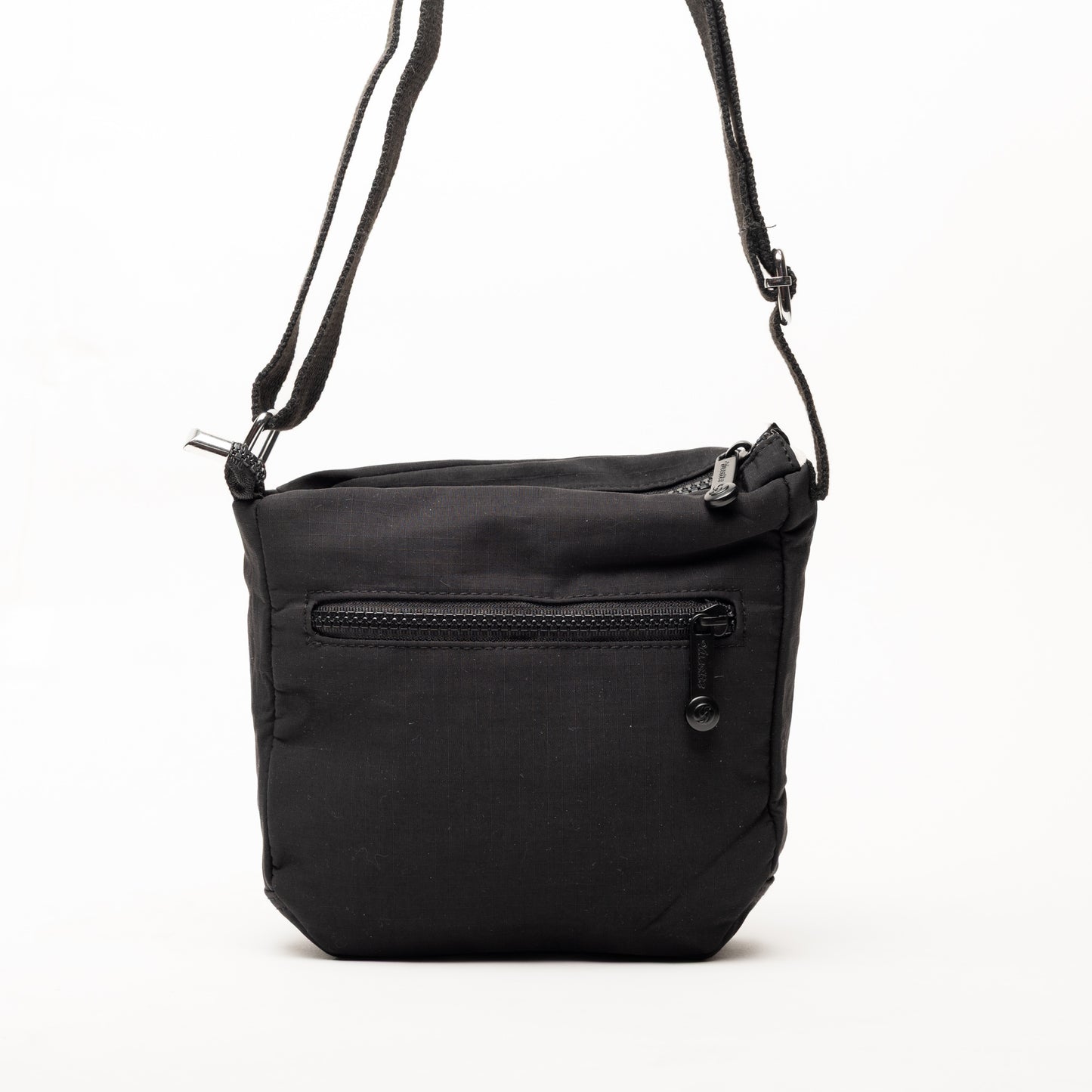 Miss Caprice Small Nylon Crossbody in black with front zip pocket and adjustable strap, on white background.