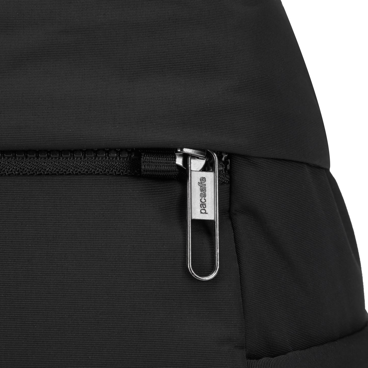 Pacsafe® CX Anti-theft 8L Backpack Petite: A black, lightweight nylon backpack with a zippered pocket and metal pull tab.