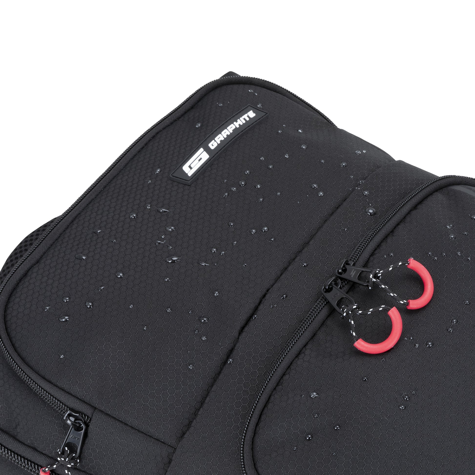Close-up of the Graphite Metamorph Convertible Travel Backpack showing water droplets on top.