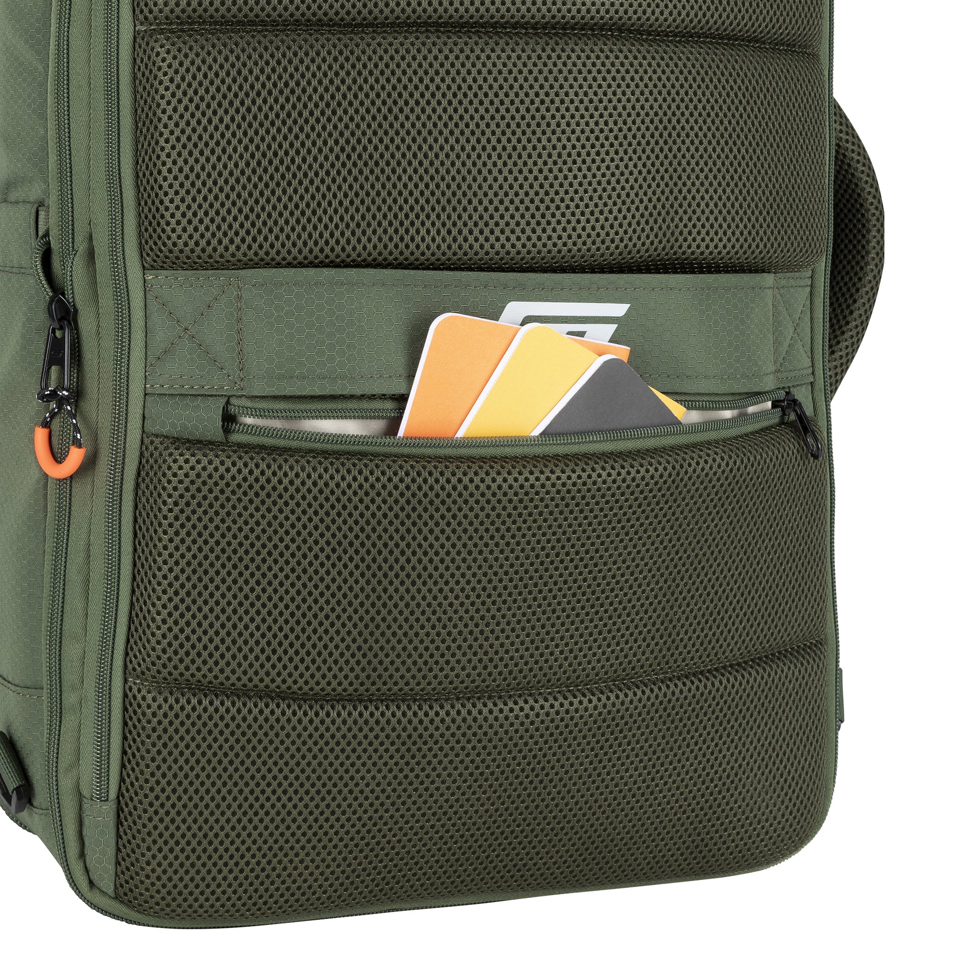A Graphite Metamorph Convertible Travel Backpack pocket holds notebooks and cards with a partially open zipper.