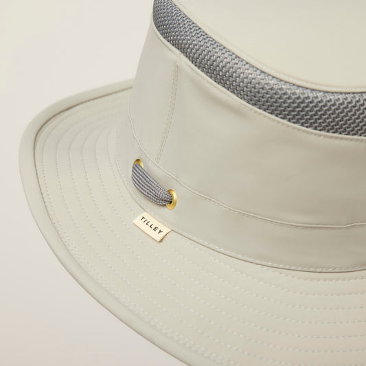 Product Image – Close-up of a Tilley LTM5 Airflo® Hat featuring sun-blocking fabric and a gray mesh ventilation band.