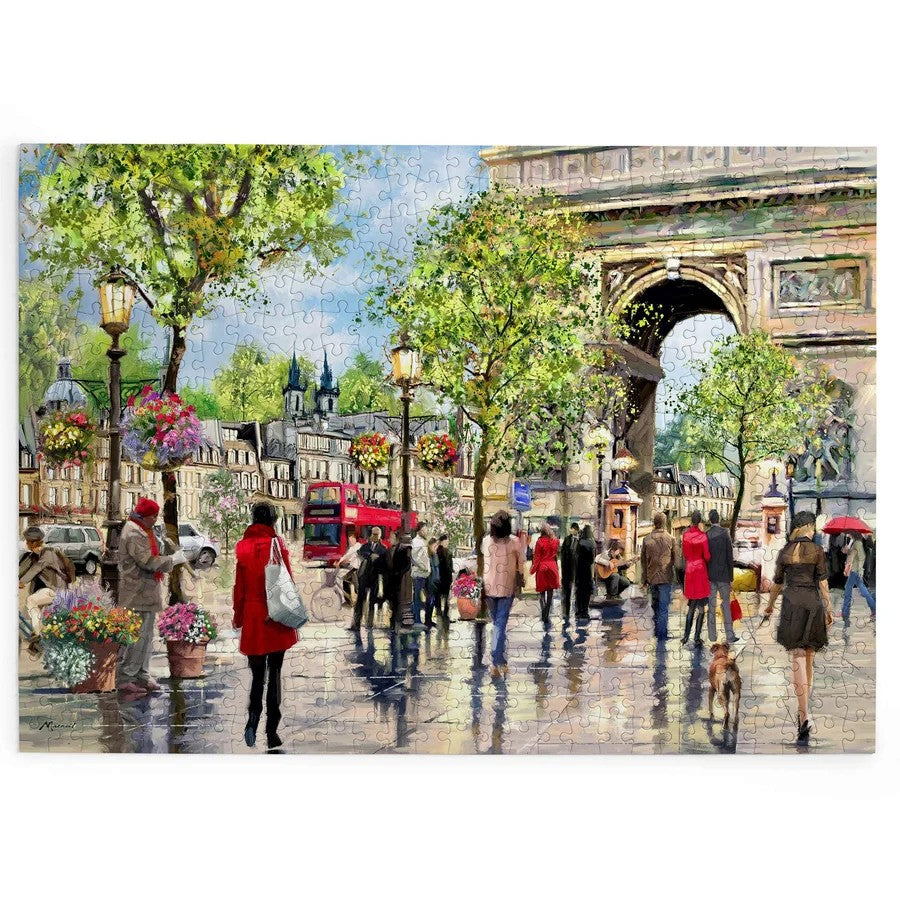 House of Puzzles BIG 500 Piece Jigsaw Puzzle - Under the Arc showing people on a street near an arched monument.